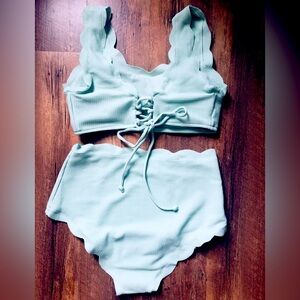 Mint green swim suit.
